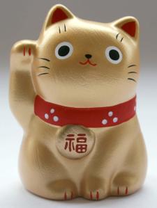 kucing melambai